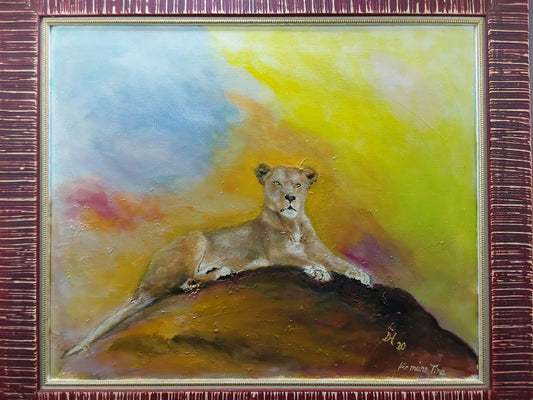 Löwin auf  Felsen